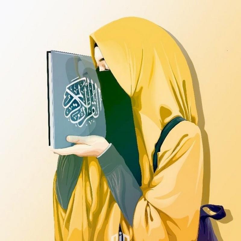 Мусульманка в платке с Кораном